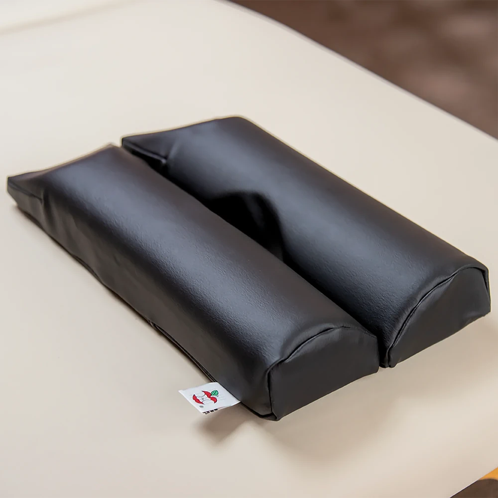 Thumbnail image of Max Relax face rest cushion in black color on a massage table