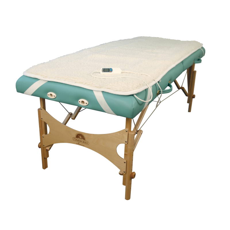 Oakworks premium table warmer shown on a portable massage table. 