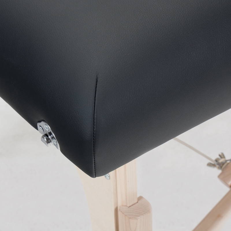 Closeup of corner stitching and option shiatsu release on Classic Deluxe Stronglite table.
